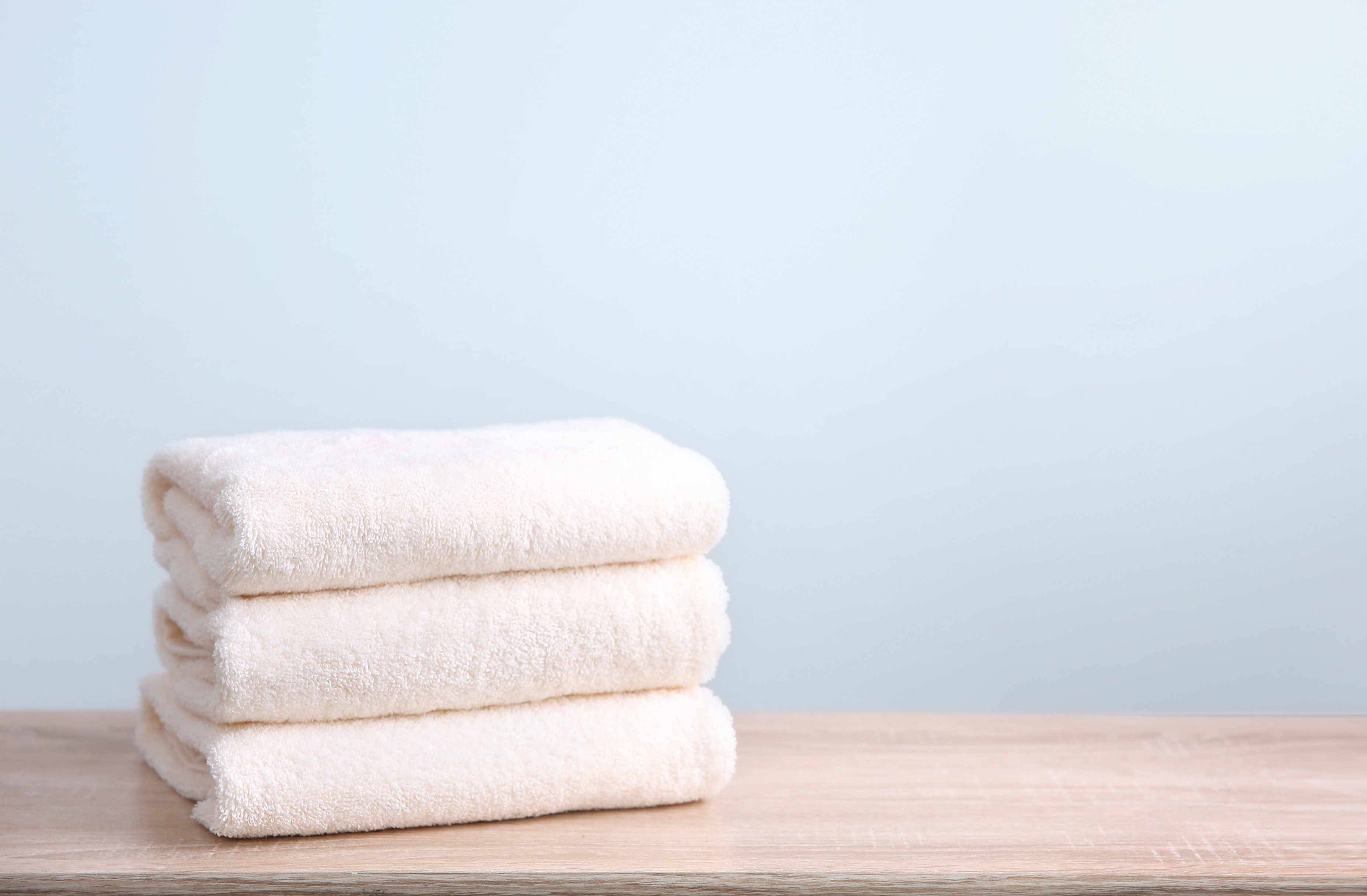 Stack of folded towels empty copy space.